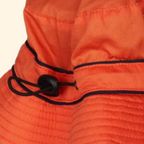 Close-up of an orange hat with a black drawstring on a matching orange background