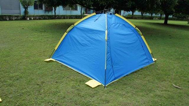 BANZ Global Umbrella Shelta Sun Shelter UV Tent - set up on grass with flap zipped shut